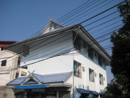 Apartment building and house in town center