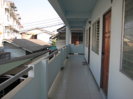 Apartment building and house in town center